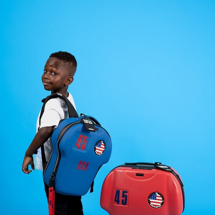 Child with blue backpack and red suitcase on a blue background